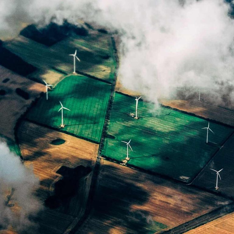 Corporate ESG - Environmental, Windfarms on the ground through the clouds